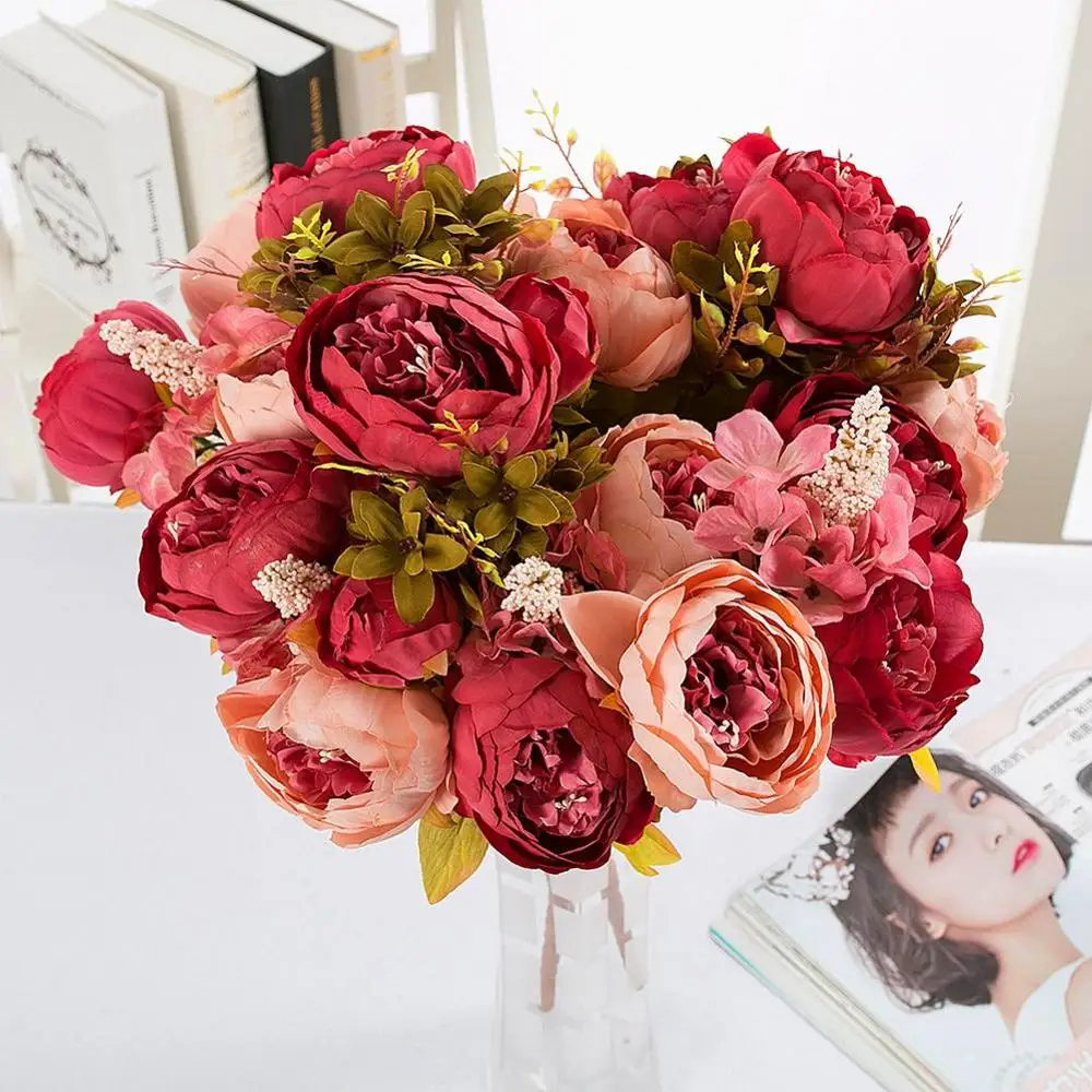 Dining room table decorated false flowers core peony peony flower shape