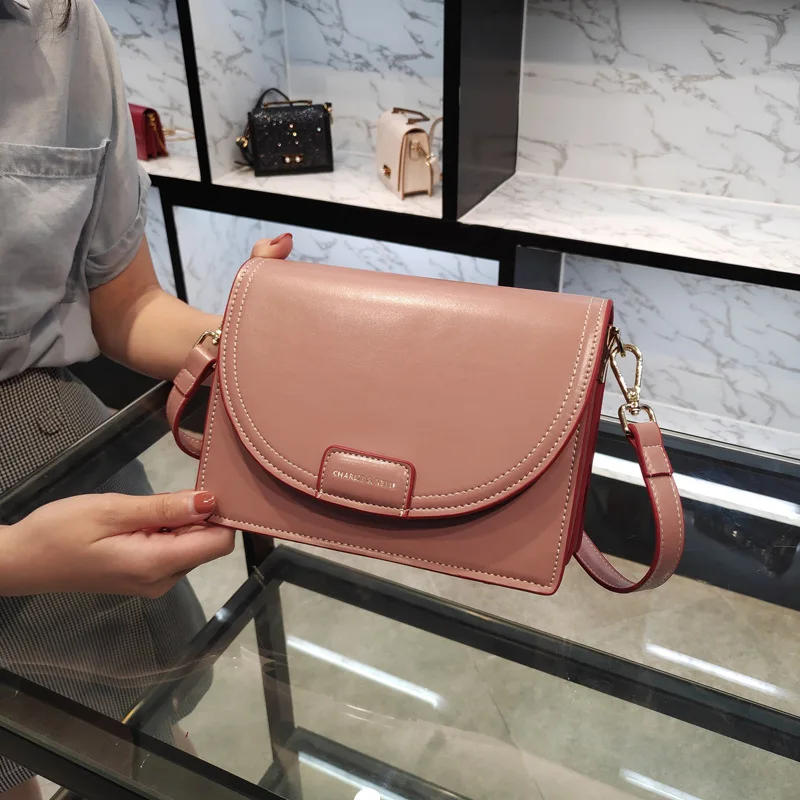 

Women's bag 2019 new Korean fashion simple solid color mailman bag Joker shoulder slung organ bag