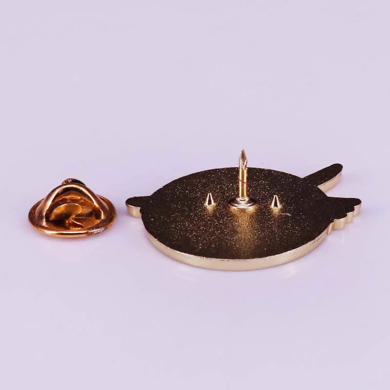 A collectible hard enamel pin to commemorate the infamous goose and their killer weapon.