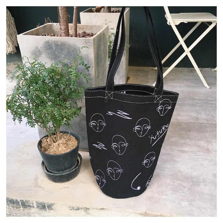 

Ougger Large Handbag Woman Shoulder Bags Summer Black Canvas Fashionable Bucket Bag with Letter Cartoon Printing for Shopping