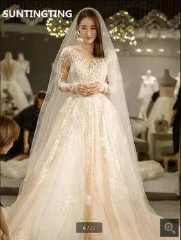 

Robe de mariage 2020 champagne tulle a line wedding dress lace appliques long sleeve with pearls sheer sexy wedding gowns
