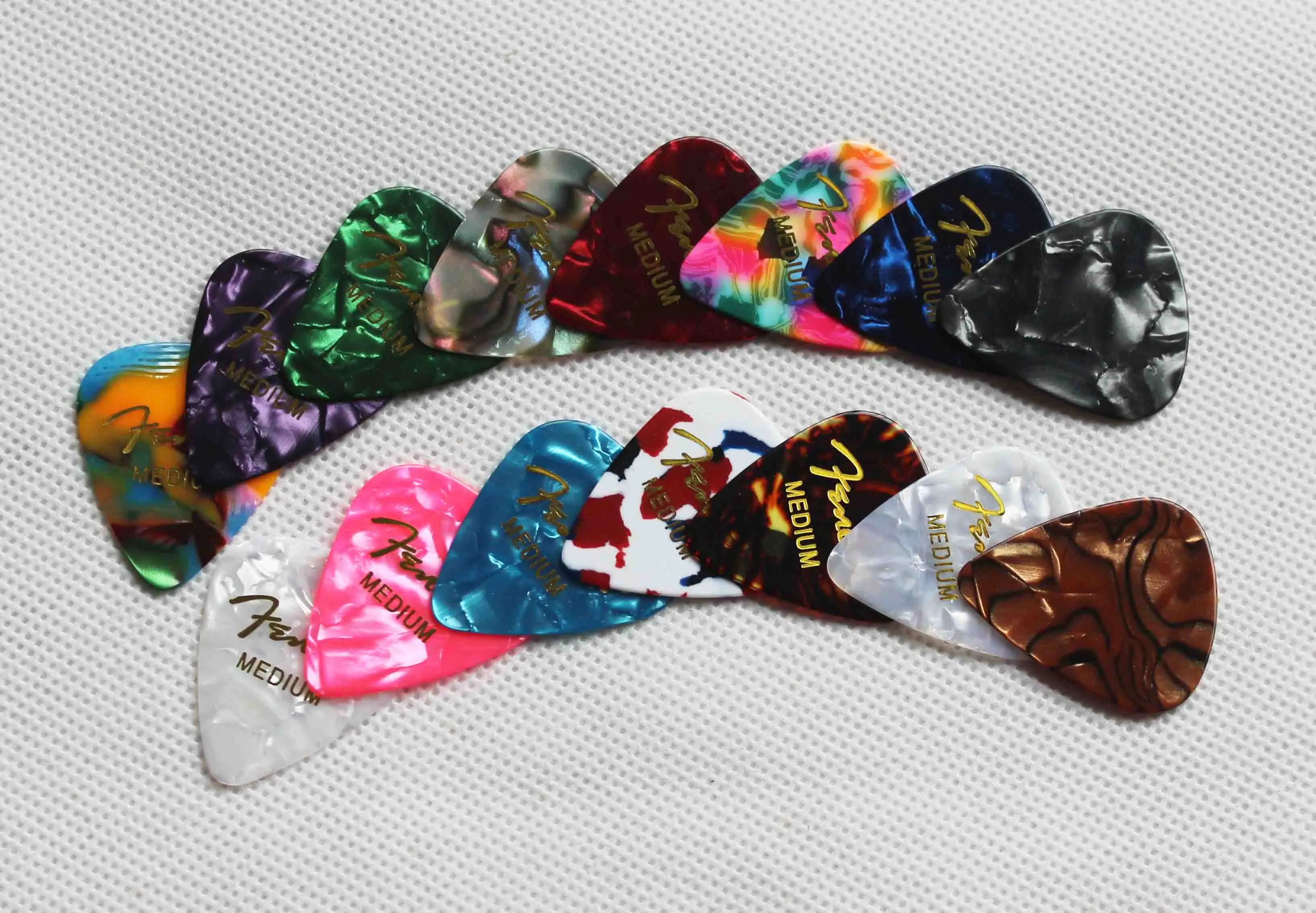 colorful pear celluloid guitar picks with gold logo printing