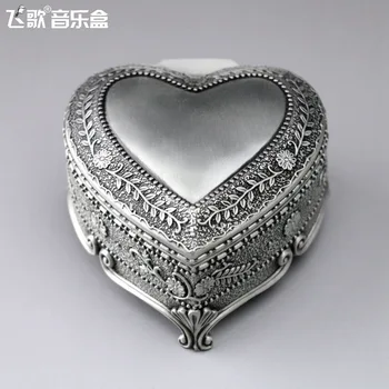 

Heart-shaped embossed music box mini metal wind-up music box