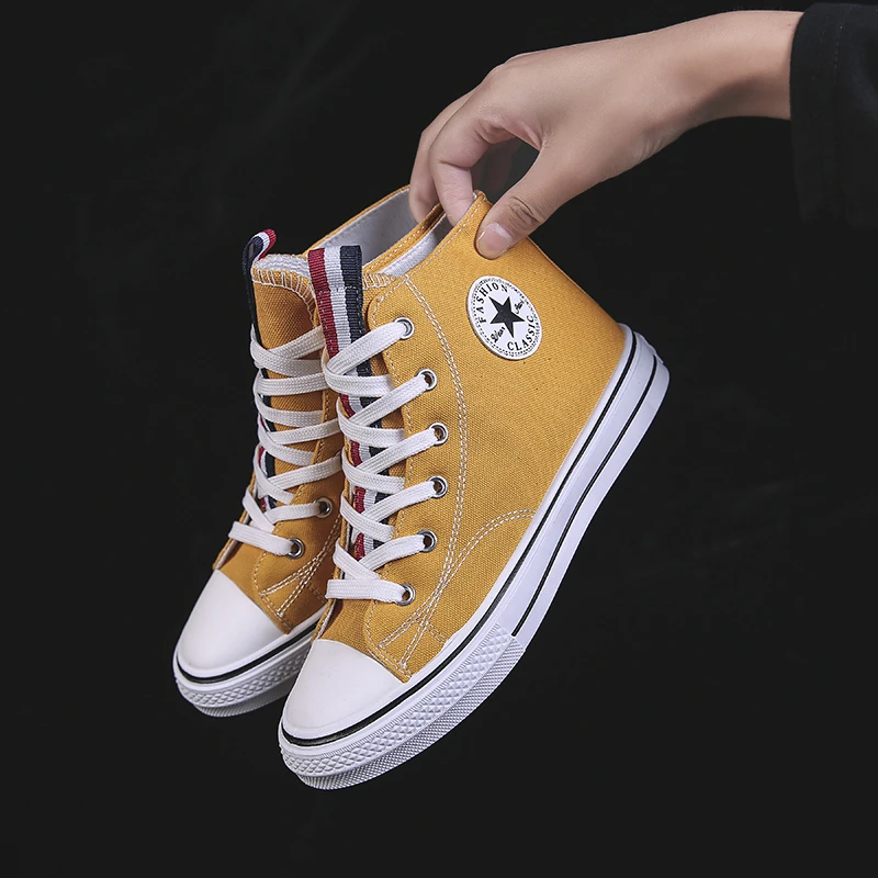 yellow high top tennis shoes