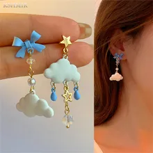 

The new 2022 cute girlie tassel bow sweet cloud asymmetrical earrings are metallic jewelry for women