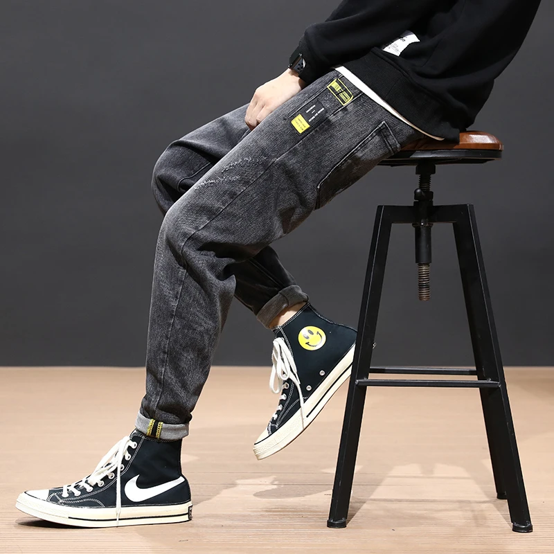 Flash Sale Fashion Streetwear Men Jeans Loose Fit Black Gray Harem Pants High Quality Korean Style Hip Hop Ripped Jeans Men Pencil Pants