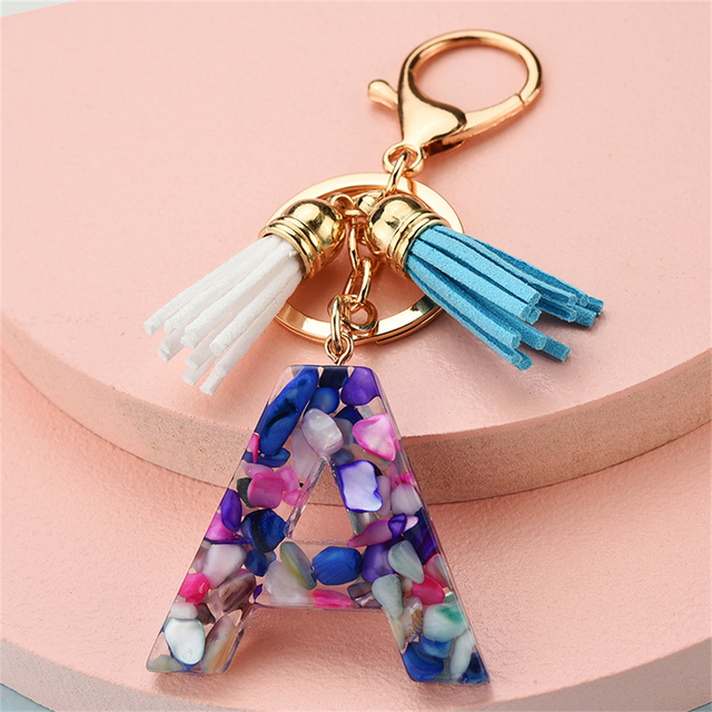 Women Keychains 26 Glitter Hollowed-out Words Handbag Tassel English Letter Keyring with Puffer Ball Charms Free Shipping
