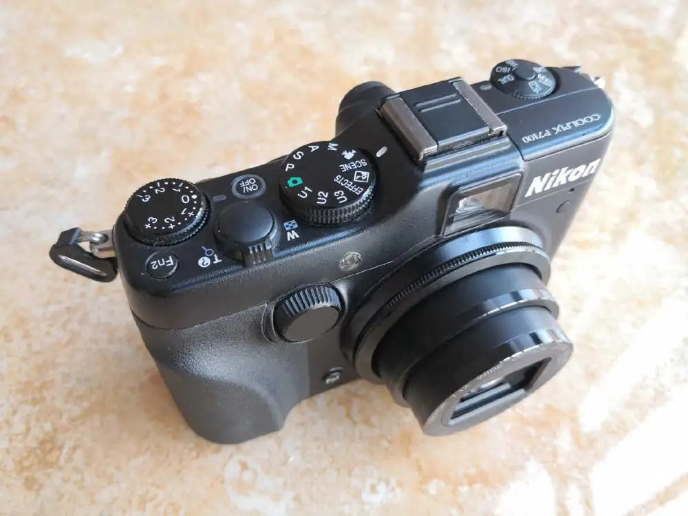 USED Nikon COOLPIX P7100 10.1 MP Digital Camera with 7.1x Optical Zoom NIKKOR ED Glass Lens and 3-Inch Vari-Angle LCD