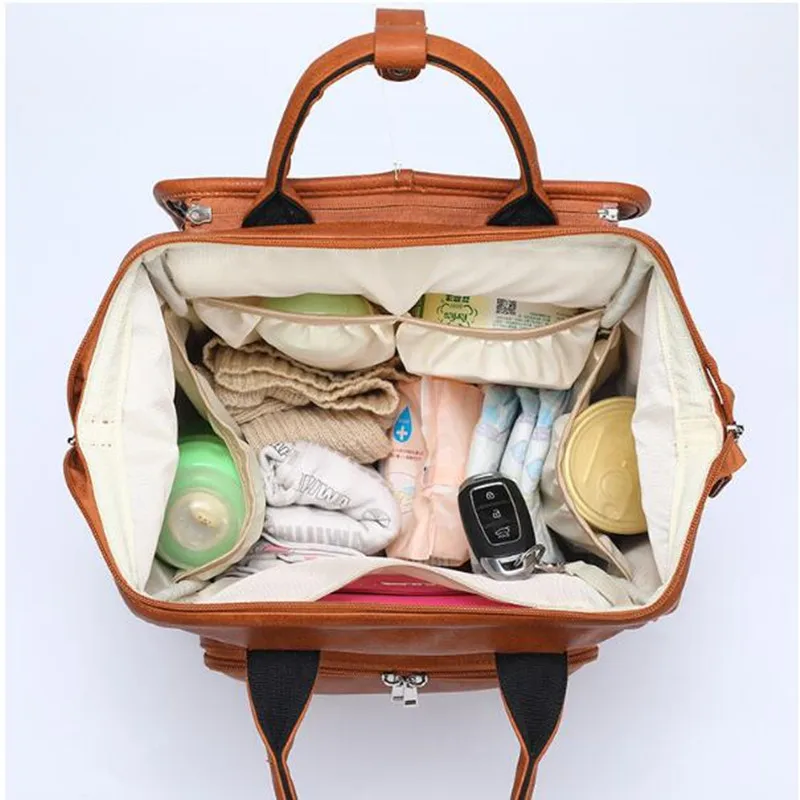 New Unisex nappy bag Fashion Quality PU Leather Baby Diaper Bag bolsa maternidade Backpack+Changing Pad+Stroller Straps