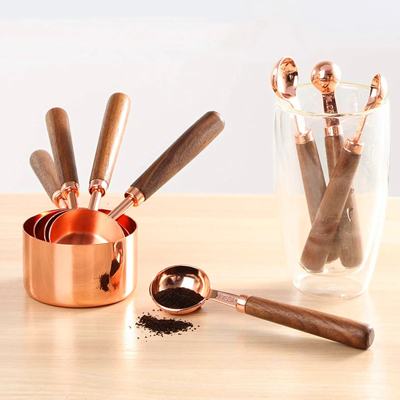 https://ae01.alicdn.com/kf/Hfc56e6d1b7554ec3bb04def7501ec0deg/4Pcs-Stainless-Steel-Measuring-Spoon-Set-with-Wooden-Handle-Measuring-Cups-Spoons-Coffee-Sugar-Measuring-Tool.jpg