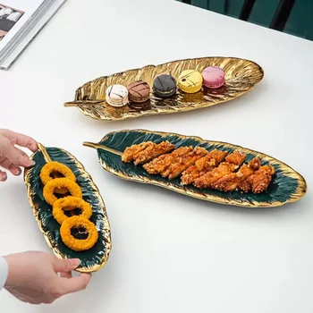 

Ceramic Luxury Golden Plate Tray Leaf Shape Snack Dessert Plates Jewelry Makeup Storage Tray for Decoration Party