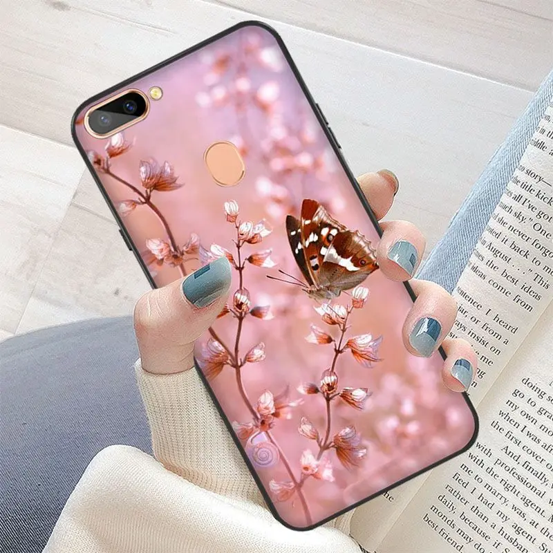 Red butterfly on white roses flower