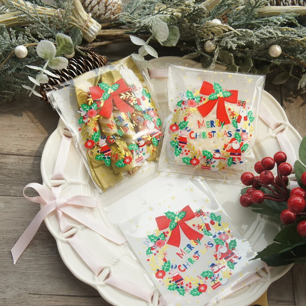 

New 10*11cm 100pcs Christmas Garland Santa Claus Bag New Year Cookie Snacks Chocolate DIY Gift Pack Party Decoration Plastic