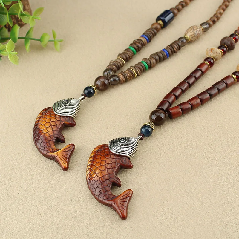 https://ae01.alicdn.com/kf/Hfd652facbe4940fa8565b336ef92b1f9P/Buddhist-Mala-Wood-Beaded-Fish-Pendant-Necklace-Long-Statement-Sweater-Necklace-Vintage-Talisman-Ethnic-Nepal-Necklace.jpg