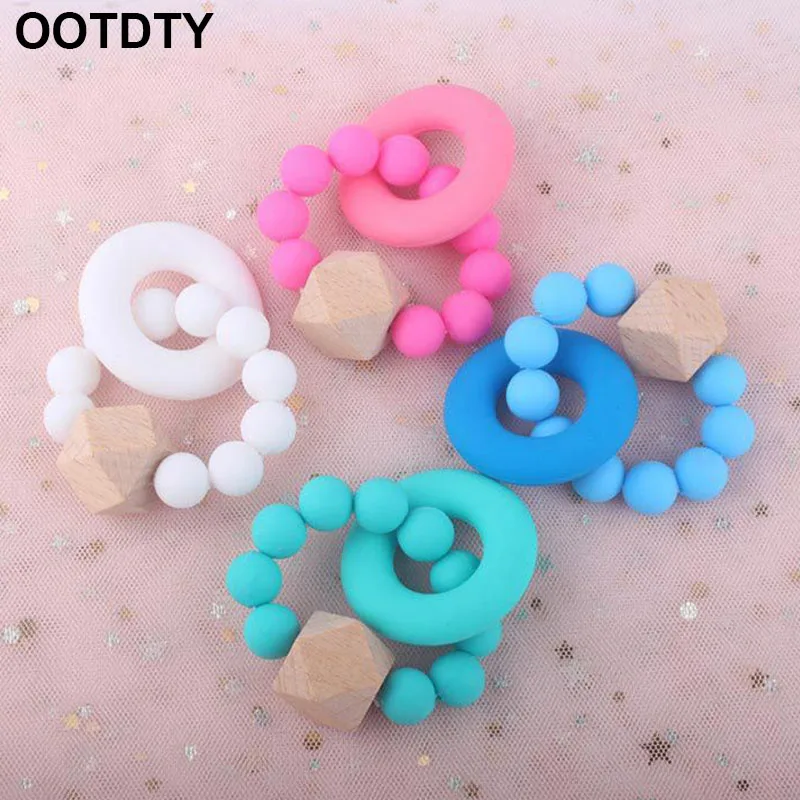 

New Infant Silicone Teether Donut Bracelet Baby Bite Molars Toy Stick Pacifier Chain