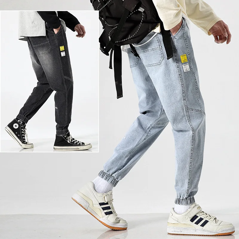 

The new 2020 summer thin light color jeans male popular logo loose bound feet nine points pants han edition joker