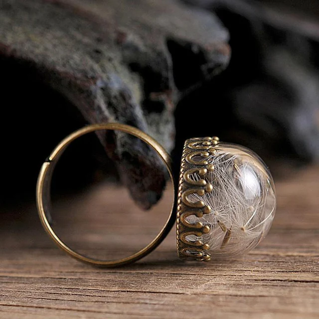 Affordable and stylish ring with real dandelion seeds.