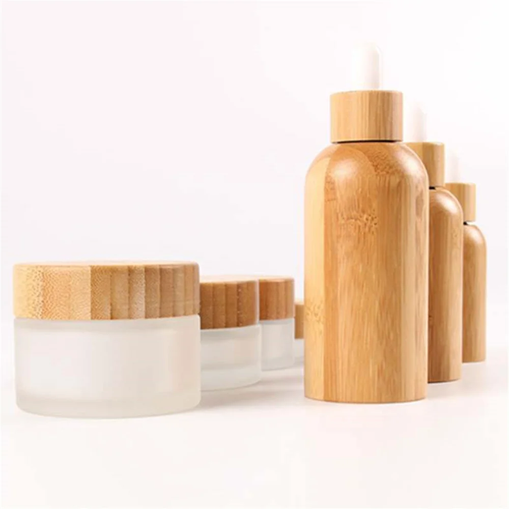 

Wholesale Customized Face Cream Cosmetic Packaging Jar With Bamboo Lid Body Cream CBD Herb Cream Glass Skin Care Container Jar