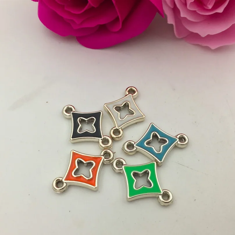 

100pcs 24*16mm Diamond-shaped four-petal flower four-leaf clover double ring connection Oil Alloy Jewelry Accessories