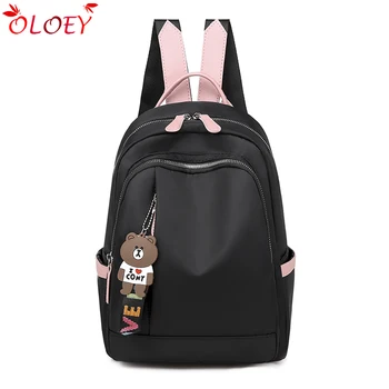 

2019 new wild backpack female fashion simple solid color Oxford cloth hit color pendant large capacity high quality leisure trav