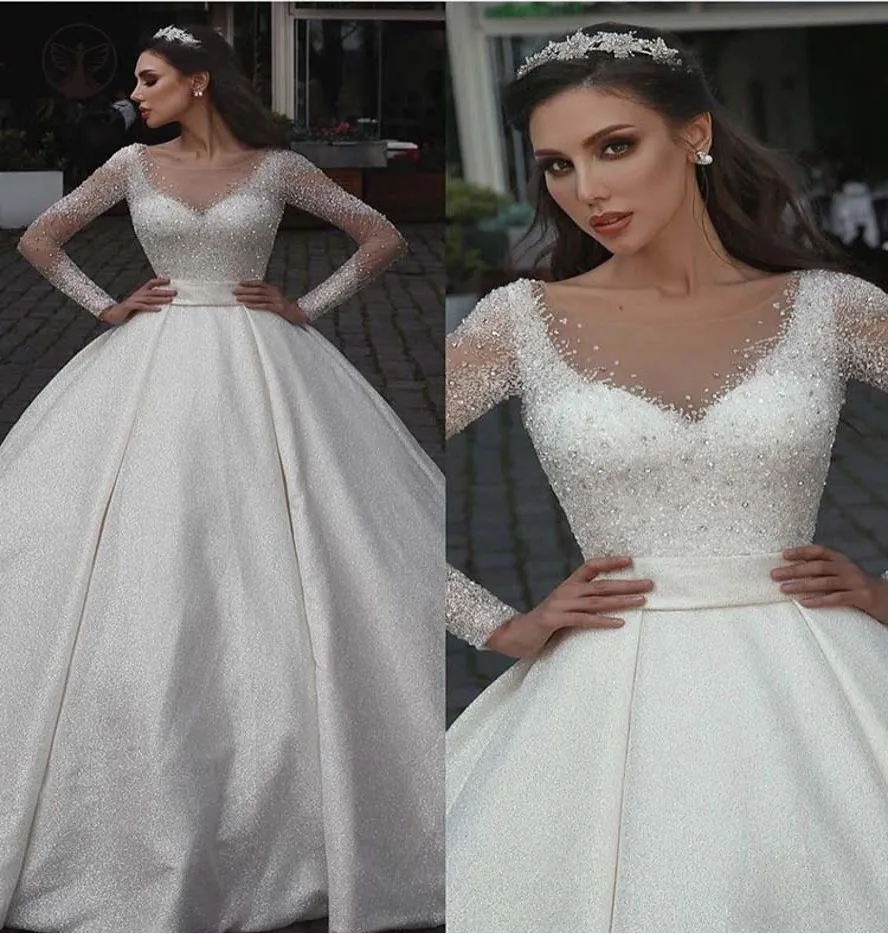 

Modest Vestidos De Mariage Sheer Neck Beaded Crystals Long Sleeve Pleated Ball Gown Bling Wedding Bridal Dresses 2021 Handmade