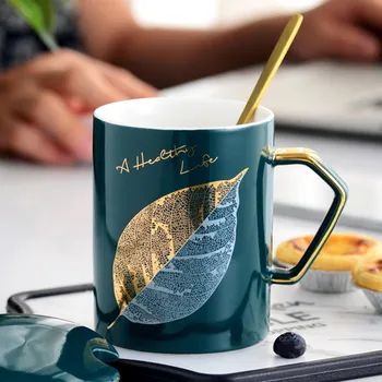 

Drop Shipping Golden Leaf Ceramic Coffee Mug Creative Green Drinking Cup With Lid Spoon Coffee Tea Cups Novelty Gifts Milk Cup