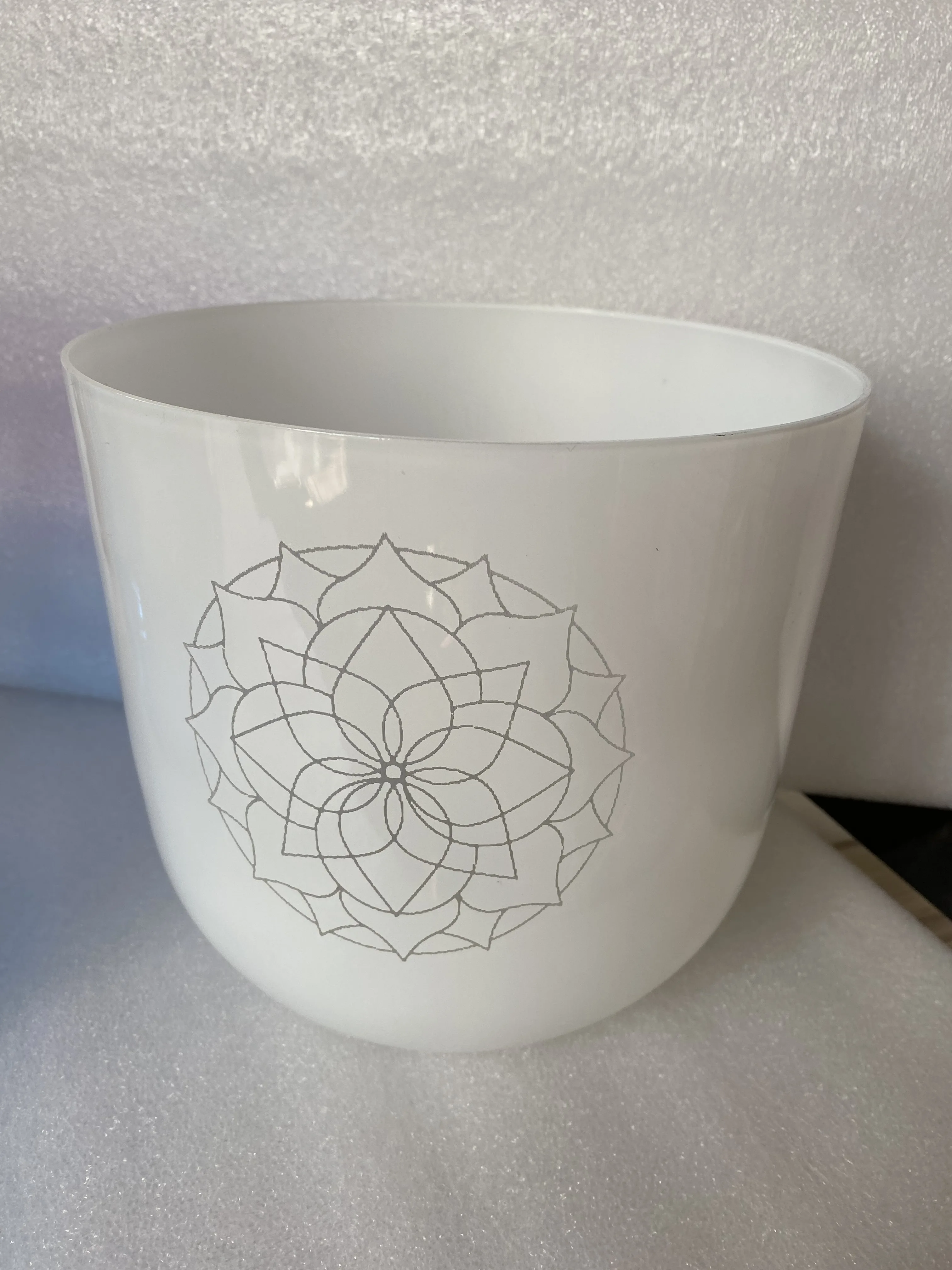 

White color crystal singing bowl with 2 engravings 3rd octave B note perfect pitch 432Hz for sound healing.