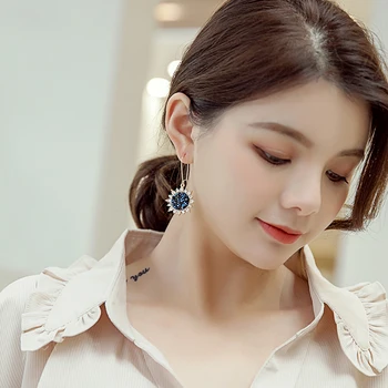 

Xinwei wholesale New personality artificial rhinestone sun flower earrings female exaggerated ear fashion wild flower earrings