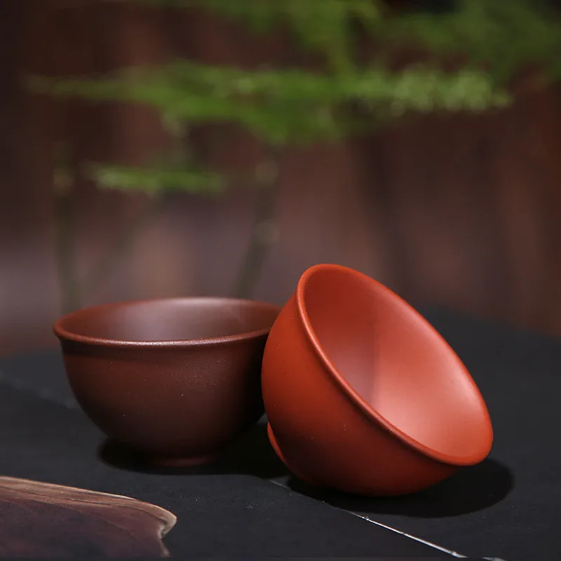 

2pcs/set Yixing Purple Clay Teacups Handmade Purple Mud Tea Cup Chinese Kung Fu Tea Set Natural Tea Bowl Office Drinking Cups