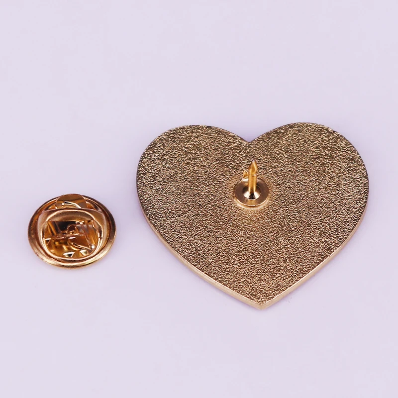 Megara heart shaped pin with a classic quote from Hercules