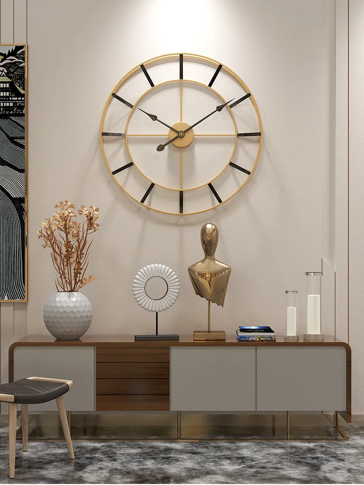 Elegant minimalist interior with a large geometric design wall clock, sideboard, decorative objects, and a stool.