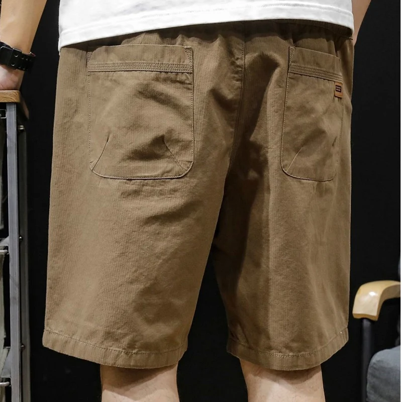 Summer New Solid Color Fashion Elastic Waist Knee Length Pants Man High Street Cotton Pocket Patchwork Button Straight Pants