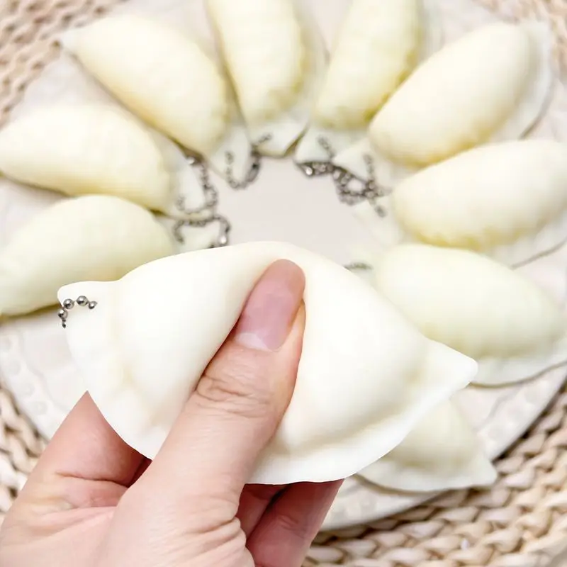 새롭고 창의적인 귀여운 사실적인 만두 모양의 느린 반응의 부드러운 스퀴즈 스트레스 해소 장난감 소품 학생 재미있는 선물 키체인 장난감 선물