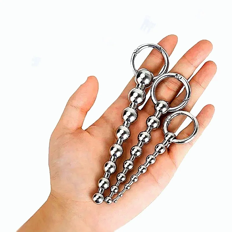 Roestvrijstalen urethrale massagekralen, functioneert als SM-inbrengkatheter in combinatie met een metalen penisplug voor mannelijk seksspeeltje._voghion.com