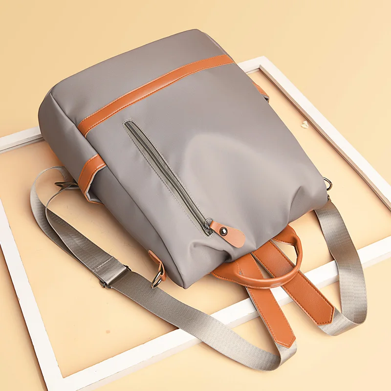 Women's fashionable black Oxford backpack, a versatile and spacious day bag suitable for travel, school or leisure outings, trav