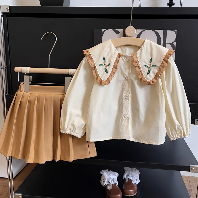 

Весна-Осень 2024 детская одежда для девочек новый весенний и осенний комплект плиссированная юбка с большими лацканами рубашка комплект из двух предметов Одежда для девочек