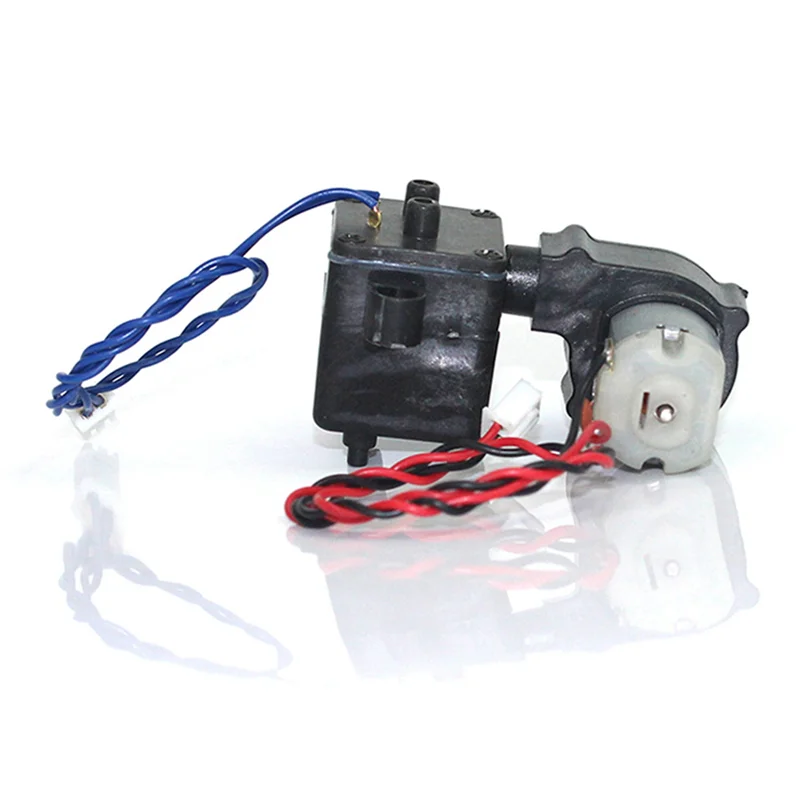 Générateur de fumée 6V pour tank RC posé sur une surface noire, avec câbles d'alimentation.