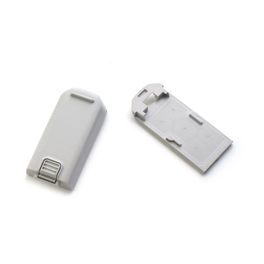 Coque de batterie DJI NEO posée sur une surface plane, montrant son design épuré.