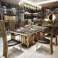 طقم طاولة طعام رخامية فاخرة من Linlamlim بإطار من الفولاذ المقاوم للصدأ باللون الذهبي، وطاولة غرفة طعام مع هيكل بحري وكراسي عالية الظهر 1