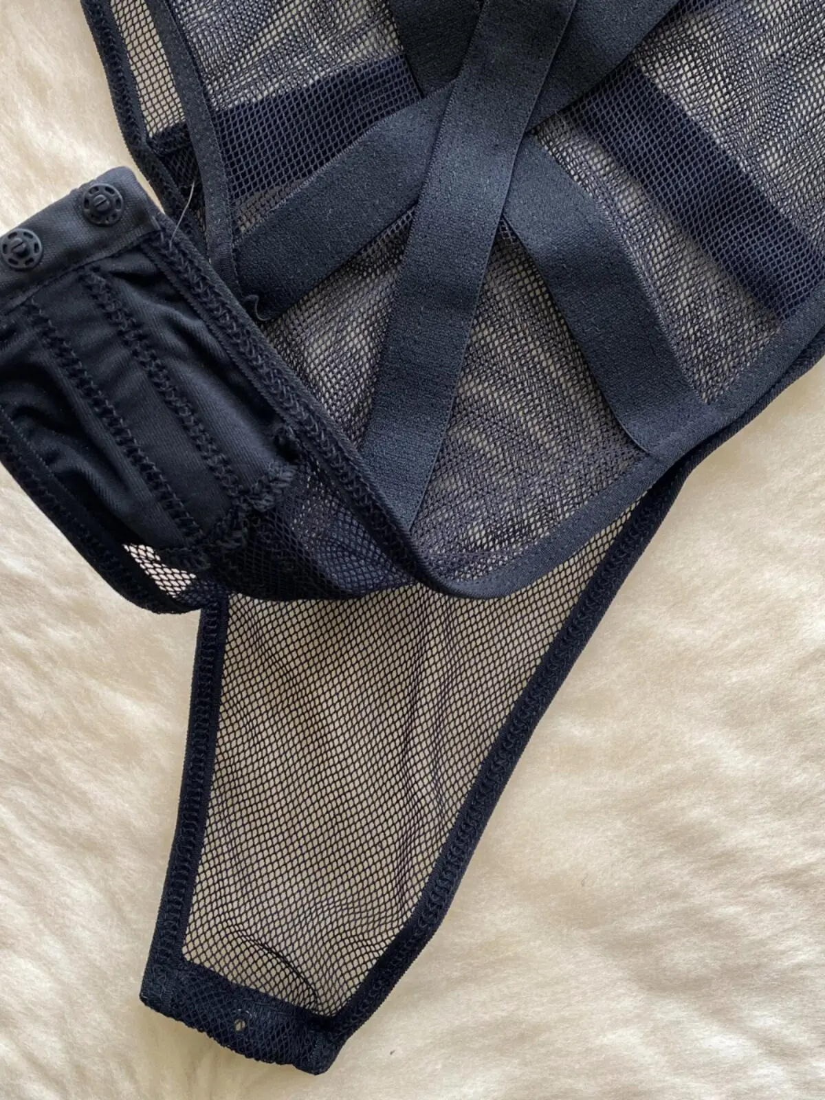 black strappy bodysuit with hollow out styling