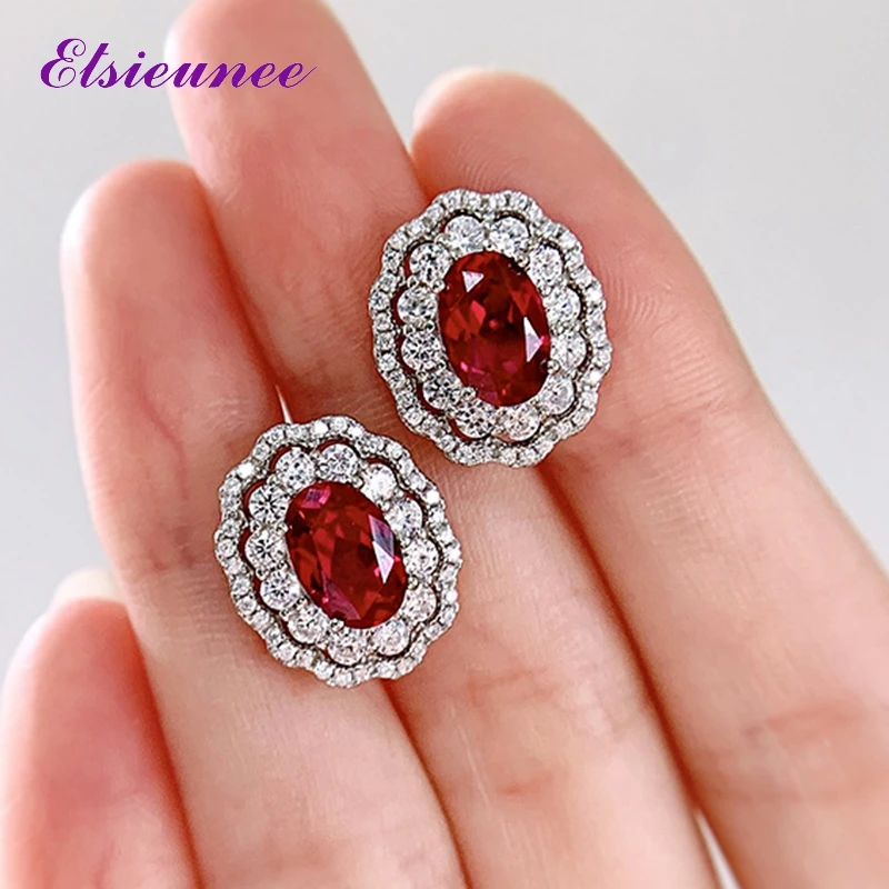

ELSIEUNEE 100% 925 Sterling Silver Oval Ruby Simulated Moissanite Gemstone Wedding Party Stud Earrings Fine Jewelry for Women