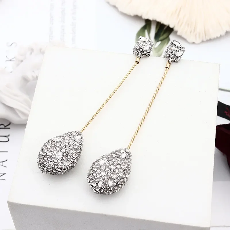 

Серьги с инкрустацией в виде капли воды дизайнерские серьги в европейском и американском стиле женские длинные серьги-гвоздики ювелирные изделия для женщин 2022 тренд