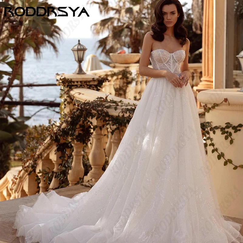 

RODDRSYA Romantic Strapless Wedding Dress Elegant Tulle Backless Bridal GownBride Party Gorgeous Sequin A-Line Vestido De Noiva