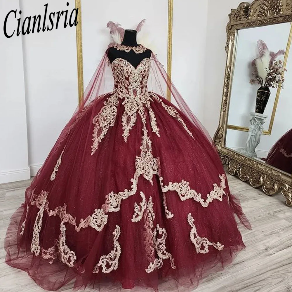 

Sparkly Burgundy Quinceanera Prom Dresses with Wrap V Neck Sweet 15 Masquerade Gold Lace Appliqued Birthday Party Gowns