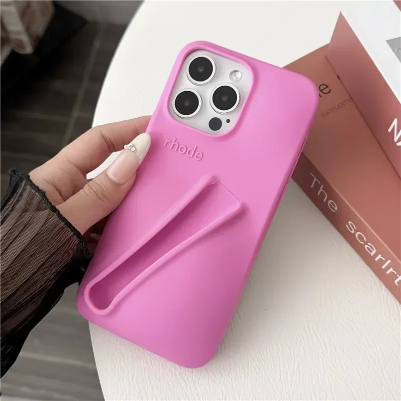 thumbnail image 1 of Estuche para teléfono de silicona suave con diseño de lápiz labial para iPhone 11, 12, 13, 14, 15 Pro Max, soporte portátil para brillo de labios Rhode Hailey, 1 of 5