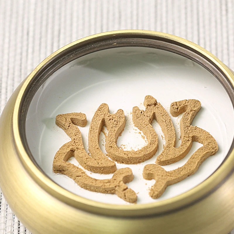 Lotus incense seal powder trail supported by white ash