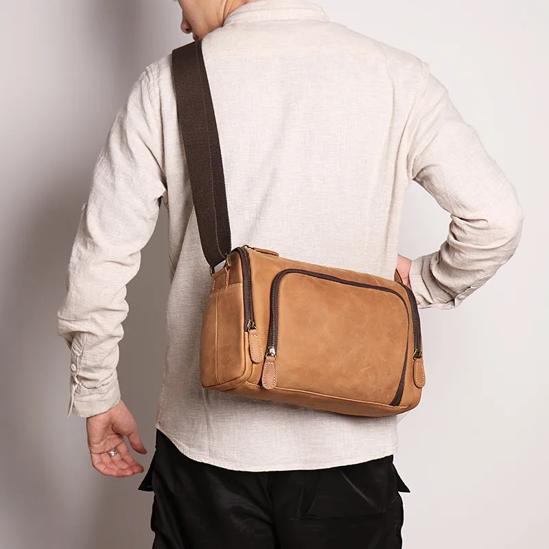 

Cylinder single shoulder baotou layer cowhide crossbody bag crazy horse leather simple fashion casual men's bag iPad bag