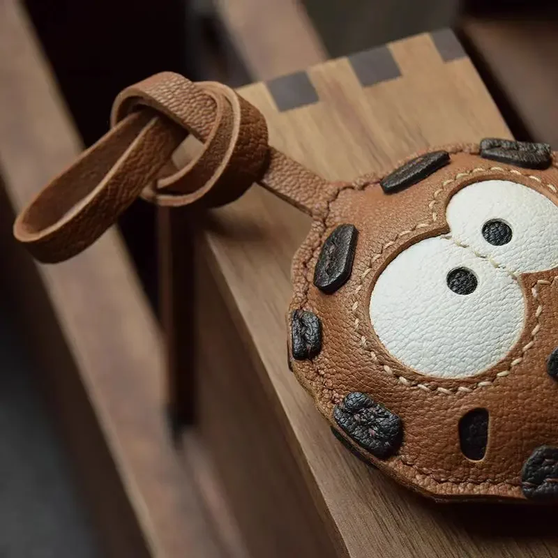 Handcrafted goatskin leather bag charm detail