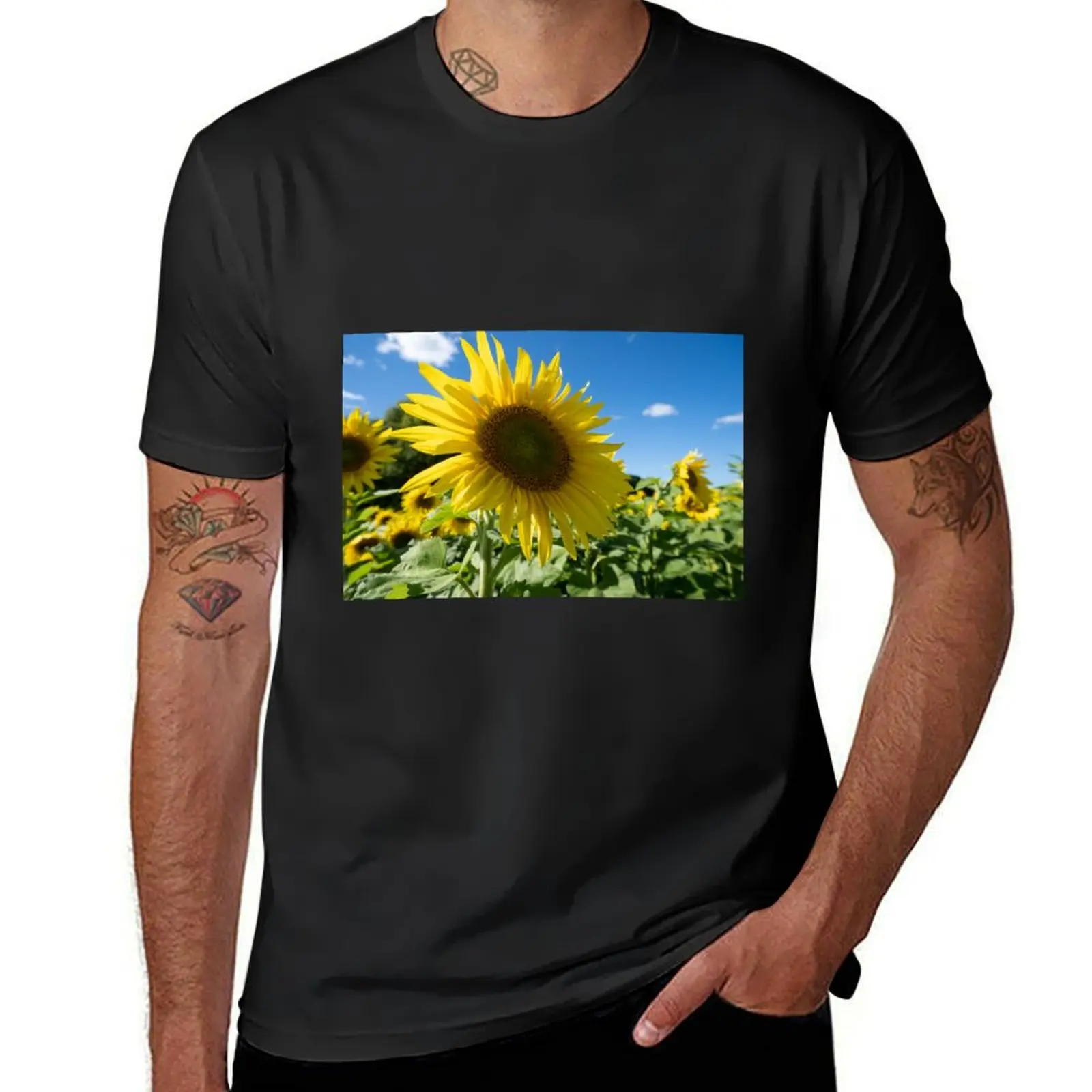 

Beautiful sunflower with bright blue summer sky T-Shirt oversizeds blanks new edition T-shirts for men cotton