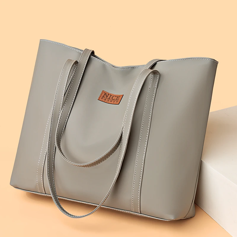 Women's tote bag, large capacity, handbag, multi pocket design, zipper closure, perfect for shopping, work, and daily travel